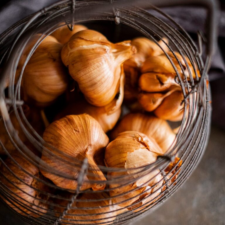 Smoked Garlic in metal basket top view